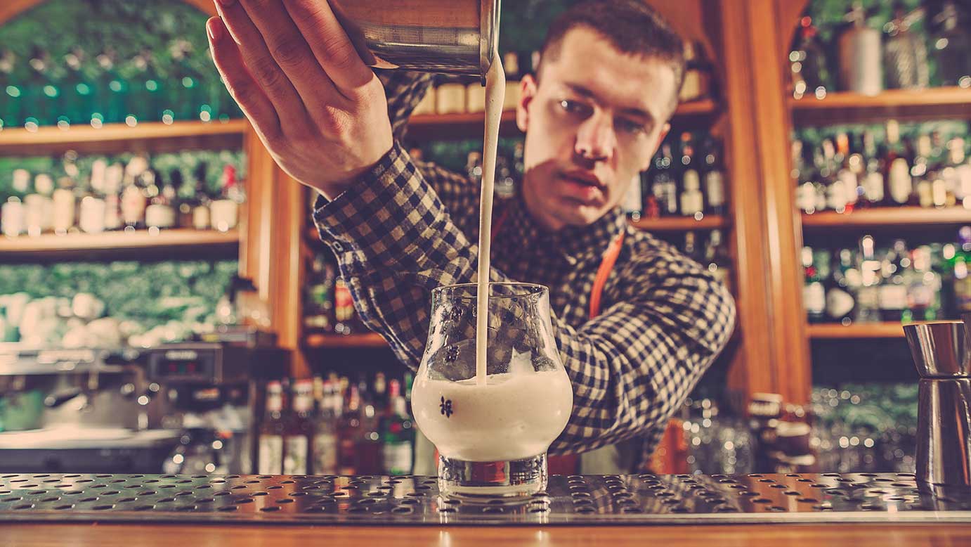 barman making an alcoholic cocktail at the bar PA3GQRX 2